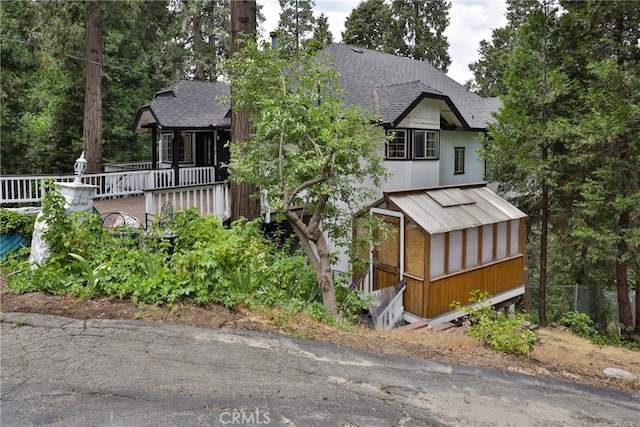 24048 Altdorf Dr, Crestline, CA 92325 - view of front of property featuring a shingled roof and a deck