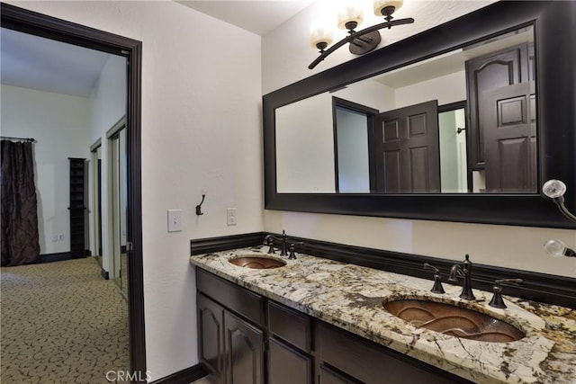 24048 Altdorf Dr, Crestline, CA 92325 - bathroom with double vanity and baseboards