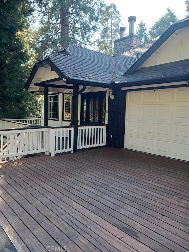 24048 Altdorf Dr, Crestline, CA 92325 - wooden deck featuring a garage