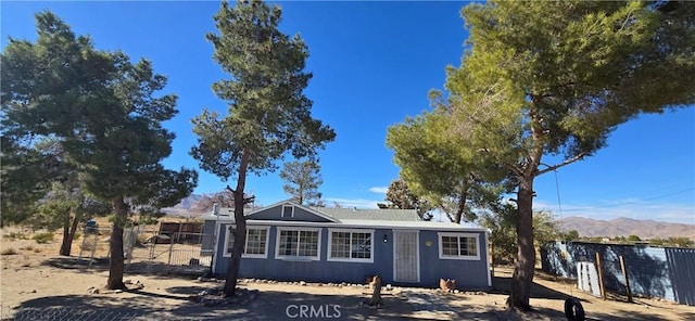 ranch-style home with a mountain view