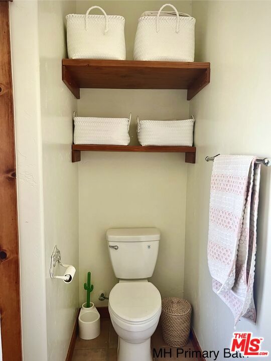 bathroom featuring tile patterned floors and toilet