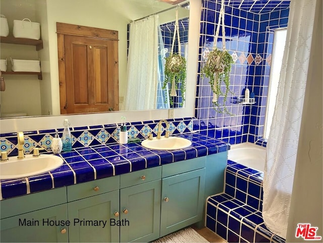 bathroom featuring vanity, decorative backsplash, and independent shower and bath