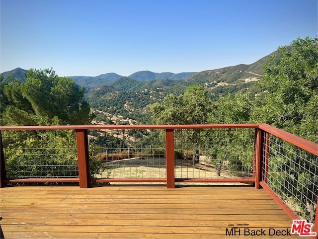 wooden terrace with a mountain view