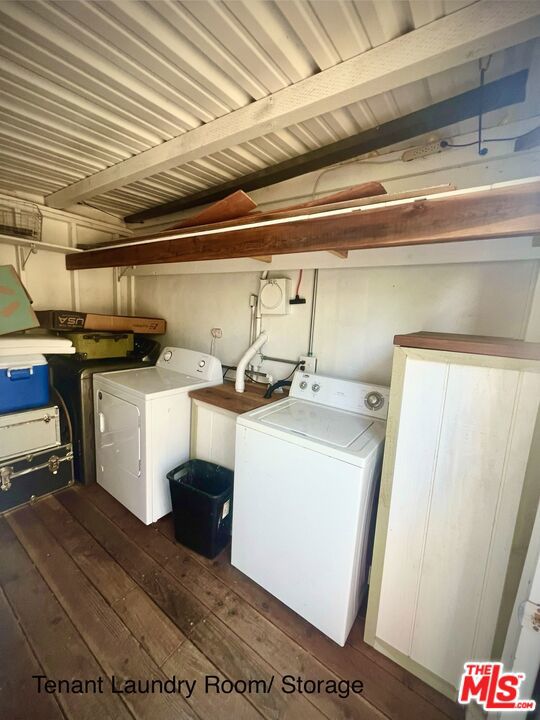 washroom with washer and dryer and dark hardwood / wood-style floors