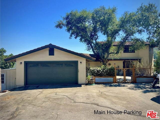 ranch-style house featuring a garage