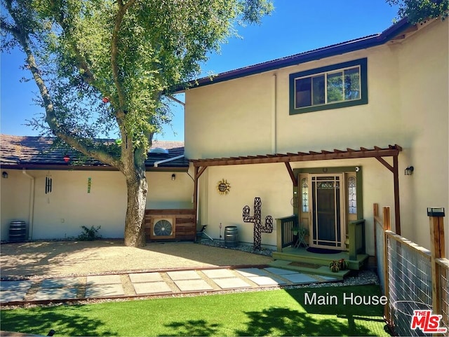 rear view of property with a patio