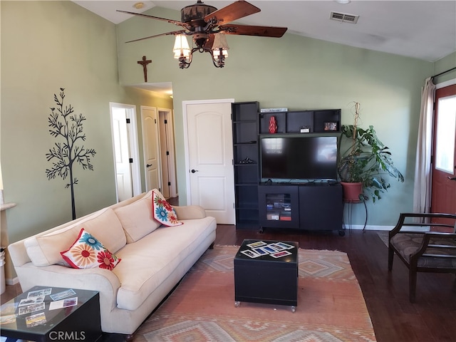 living room featuring vaulted ceiling, dark wood-type flooring, and ceiling fan