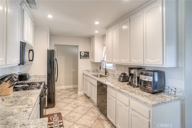 kitchen with sink, white cabinetry, and black appliances