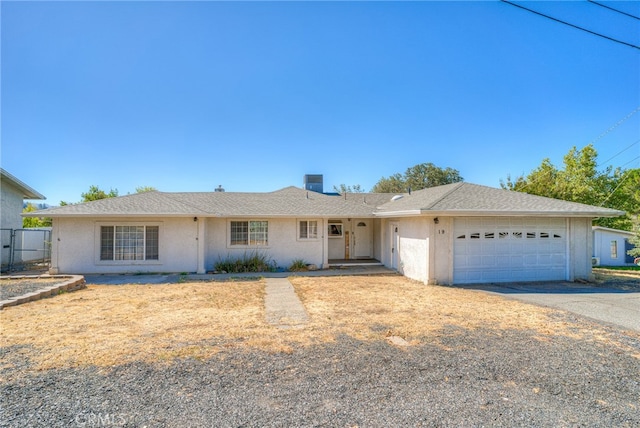 single story home featuring a garage