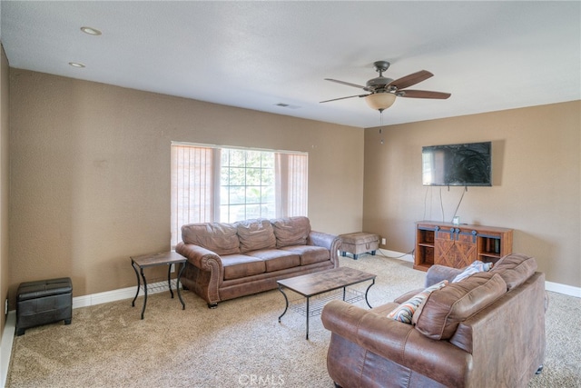 living room with light carpet and ceiling fan