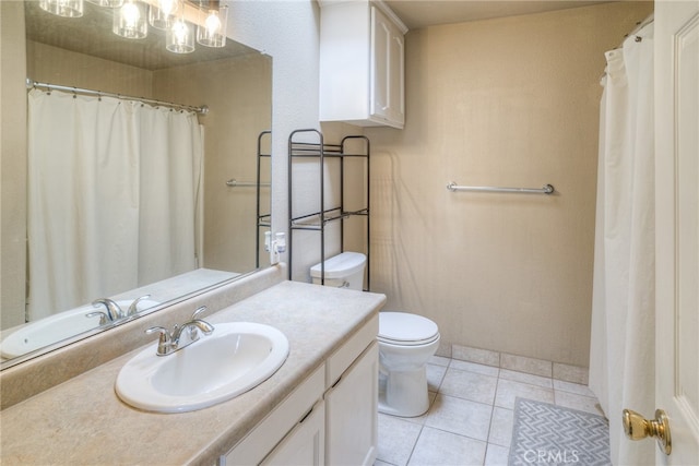 bathroom featuring vanity, toilet, and tile patterned floors