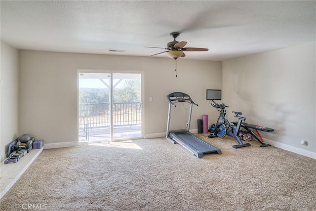 exercise room with ceiling fan, a textured ceiling, and carpet flooring