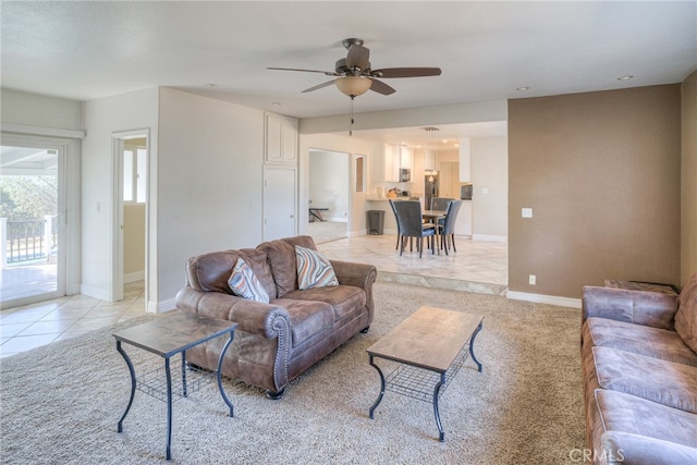 living room with light tile patterned floors and ceiling fan