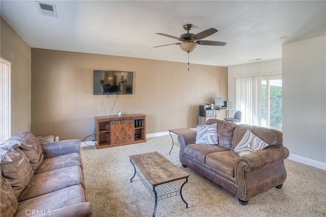 living room with light carpet and ceiling fan