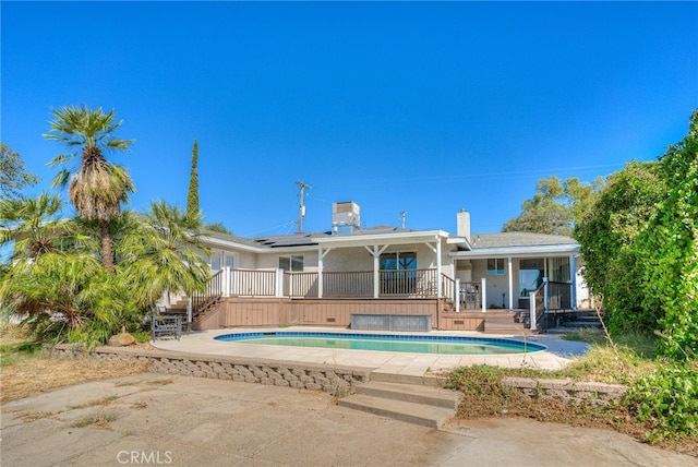 rear view of property featuring a patio area