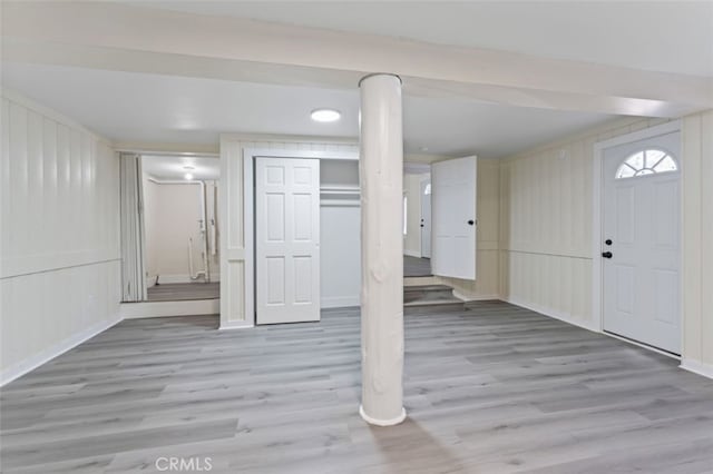 basement featuring light hardwood / wood-style flooring