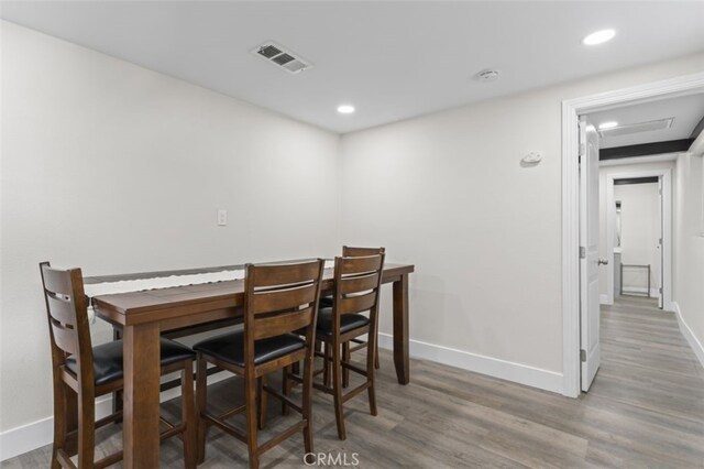 dining space featuring wood-type flooring