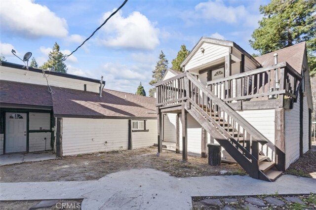 exterior space featuring a wooden deck