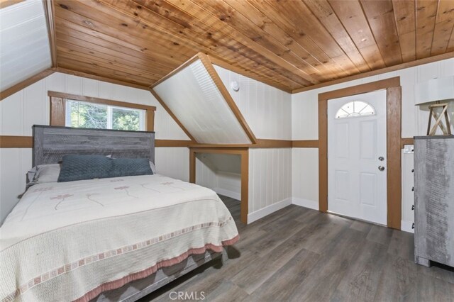 bedroom with dark hardwood / wood-style flooring, wood ceiling, and vaulted ceiling