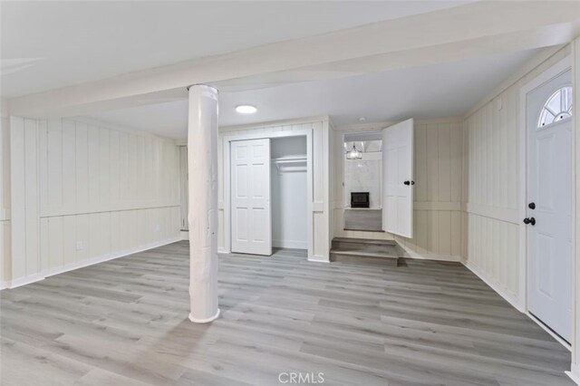 basement featuring light hardwood / wood-style floors