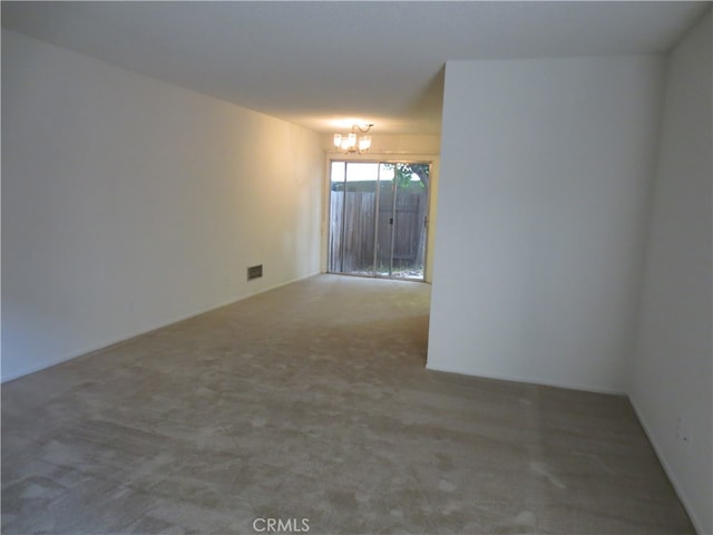 spare room featuring carpet flooring