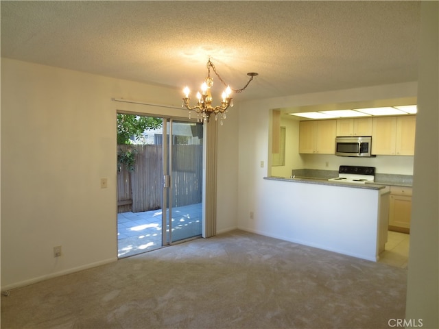 kitchen with decorative light fixtures, white cabinetry, white stove, light carpet, and a notable chandelier