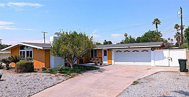 ranch-style home featuring a garage