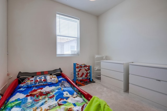 bedroom with light colored carpet