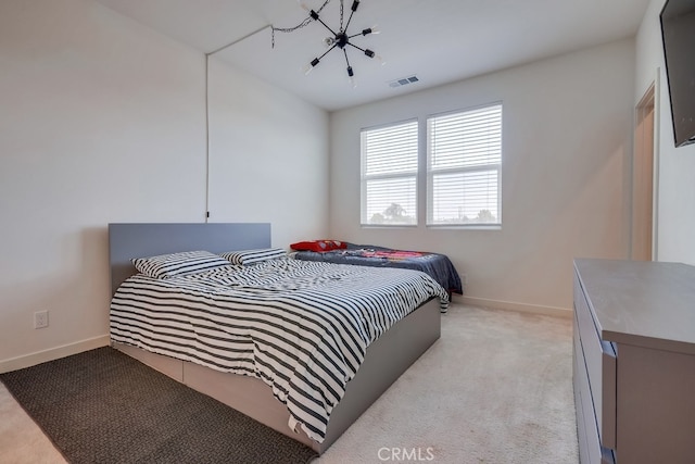 bedroom featuring light carpet