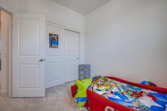 carpeted bedroom featuring a closet