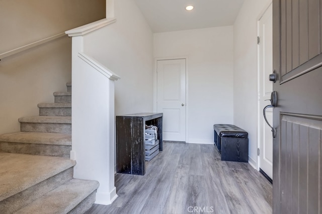 foyer entrance with light wood-type flooring