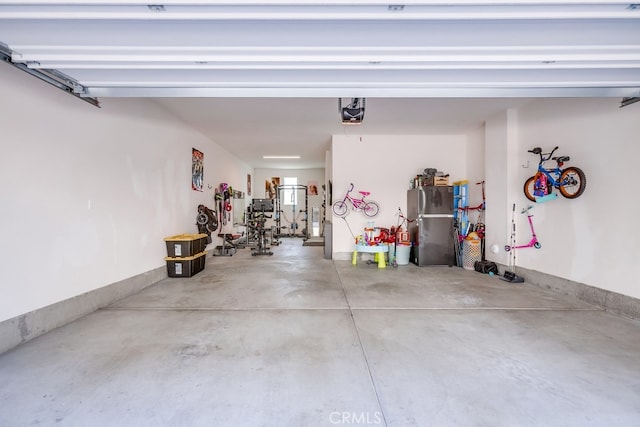 garage with stainless steel fridge