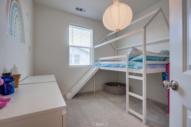 bedroom with light colored carpet