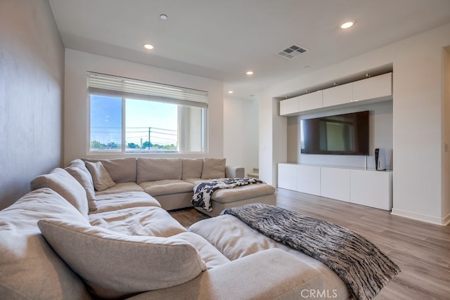 living room with light hardwood / wood-style flooring