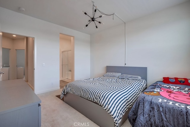 carpeted bedroom featuring ensuite bathroom