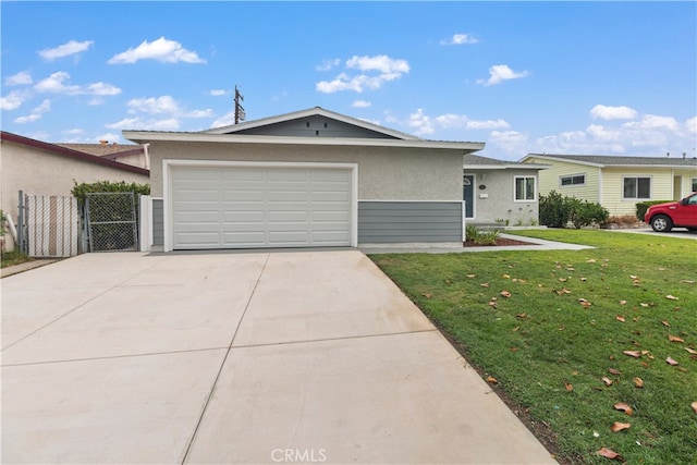 ranch-style home with a front yard and a garage