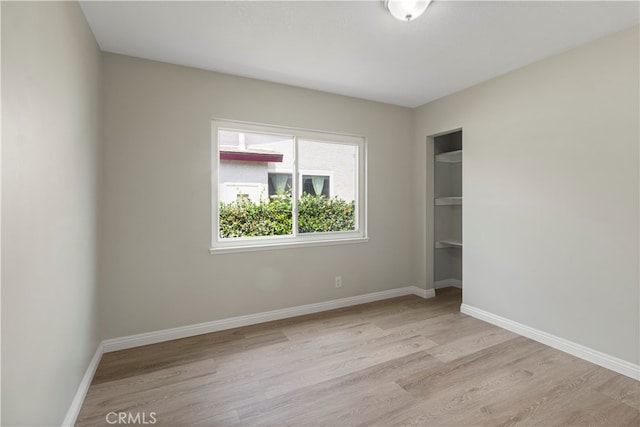 empty room with light hardwood / wood-style floors