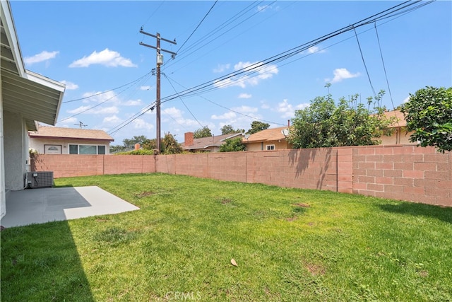 view of yard featuring a patio and central air condition unit