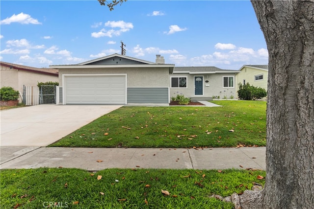 ranch-style house featuring a front lawn and a garage