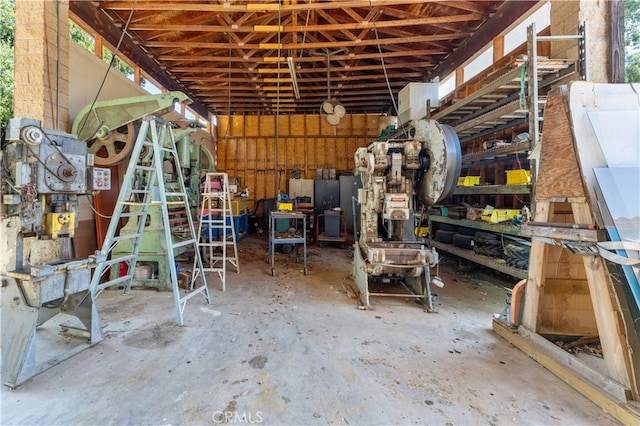 miscellaneous room with a healthy amount of sunlight and concrete flooring