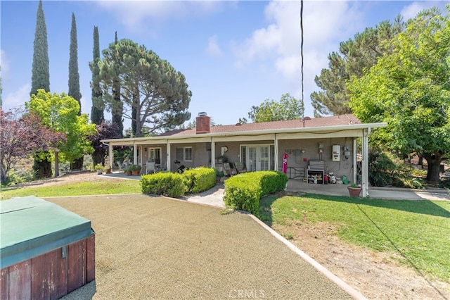 view of front of house with a porch and a front lawn