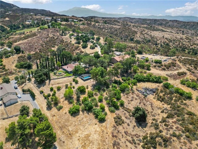 birds eye view of property with a mountain view