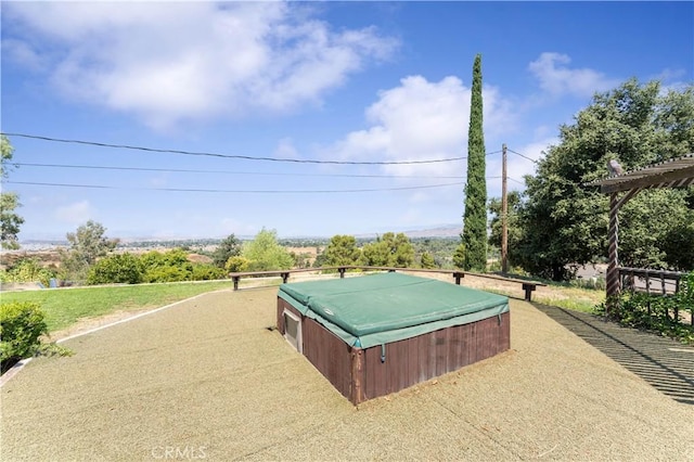exterior space with a hot tub