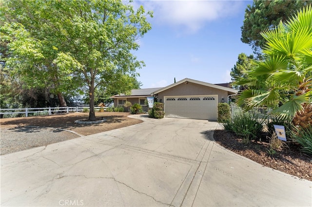 ranch-style home with a garage