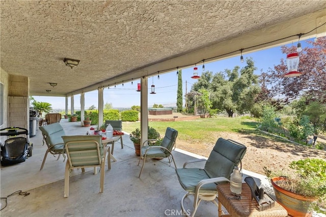 view of patio featuring outdoor dining area