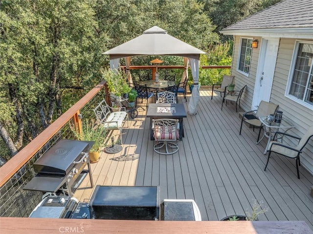 39309 Forest Park Ln, Oakhurst, CA 93644 - wooden terrace with a fire pit, area for grilling, and outdoor dining space
