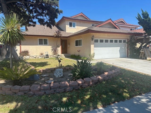 view of front of home featuring concrete driveway, a front lawn, an attached garage, and stucco siding