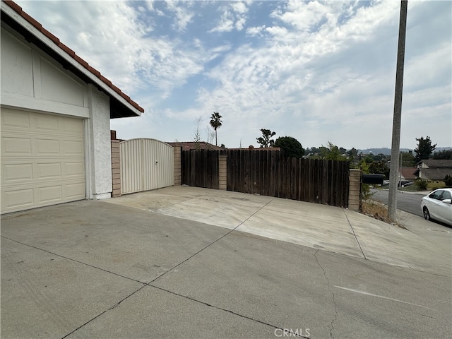 view of patio / terrace featuring a garage