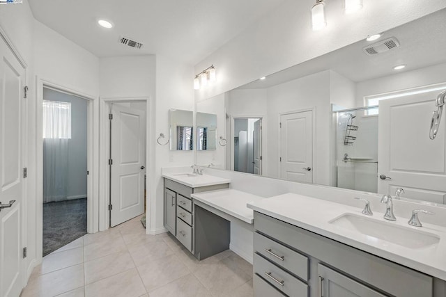 bathroom featuring vanity, tile patterned floors, and an enclosed shower