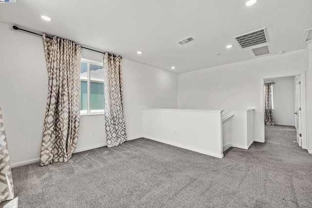 unfurnished room with carpet floors